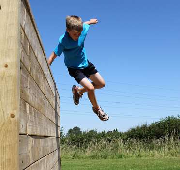 Kid jumping over wall